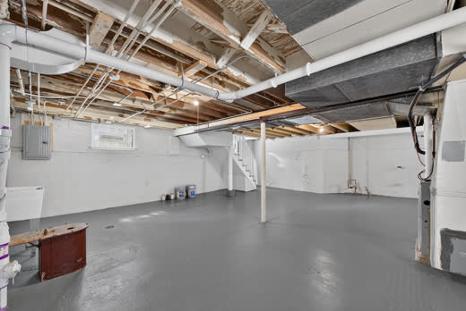 Open basement level with gray painted concrete floors at 9205 S Utica Ave