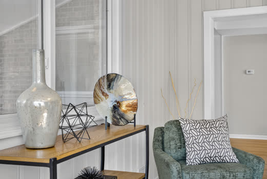 Enclosed sun porch with white paneling and staged decor at 9205 S Utica Ave, Evergreen Park